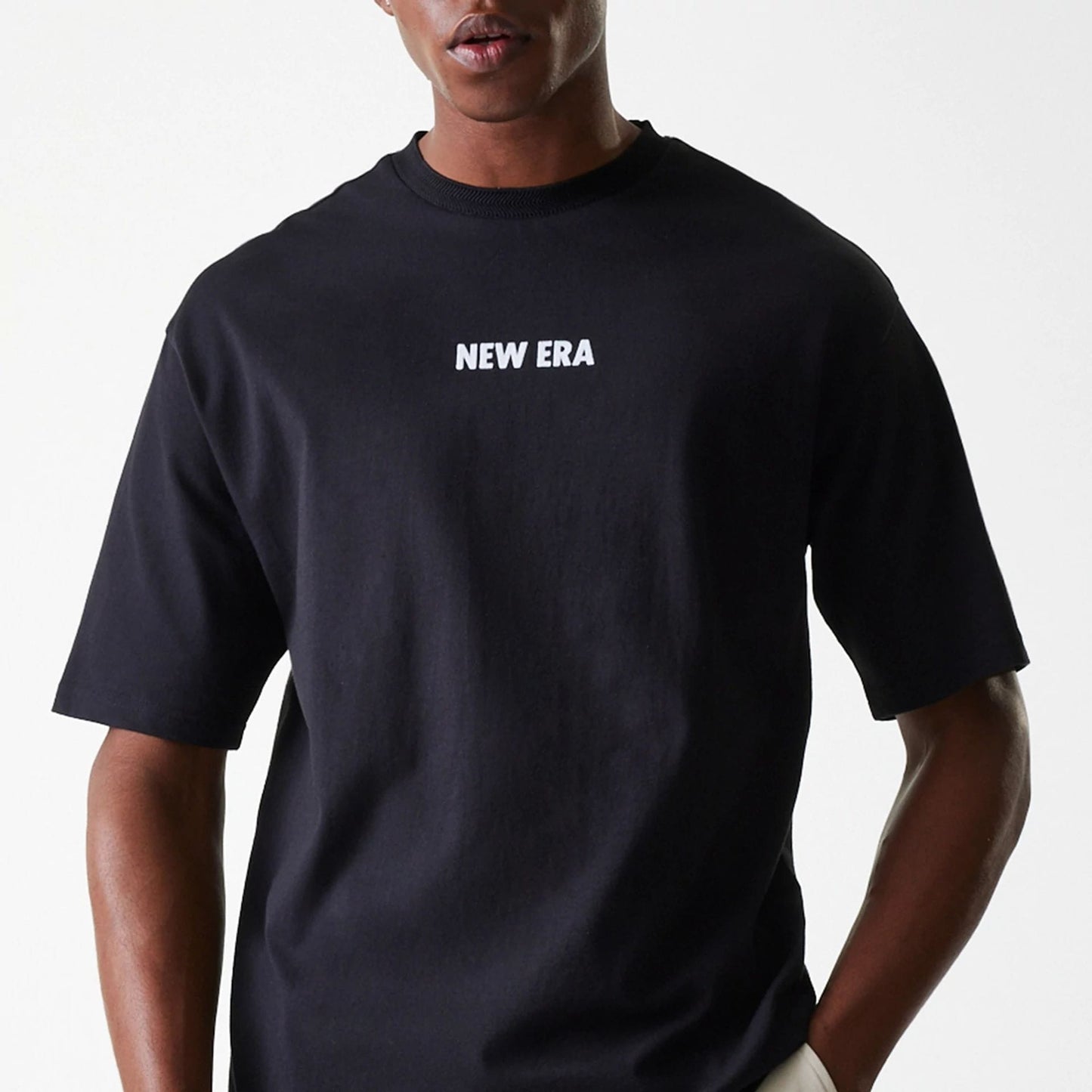 The Male model is wearing New Era Graphic Black Oversized T-Shirt 3