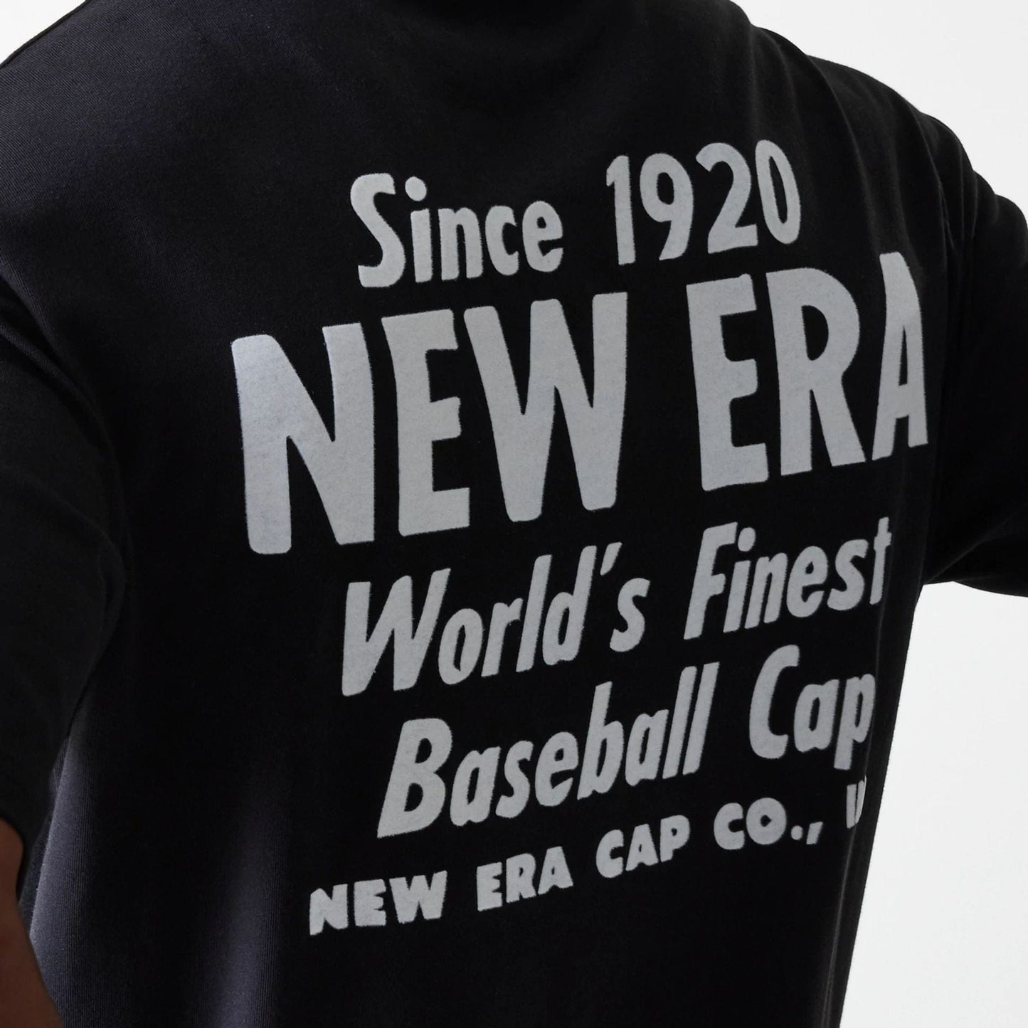 The Male model is wearing New Era Graphic Black Oversized T-Shirt 6