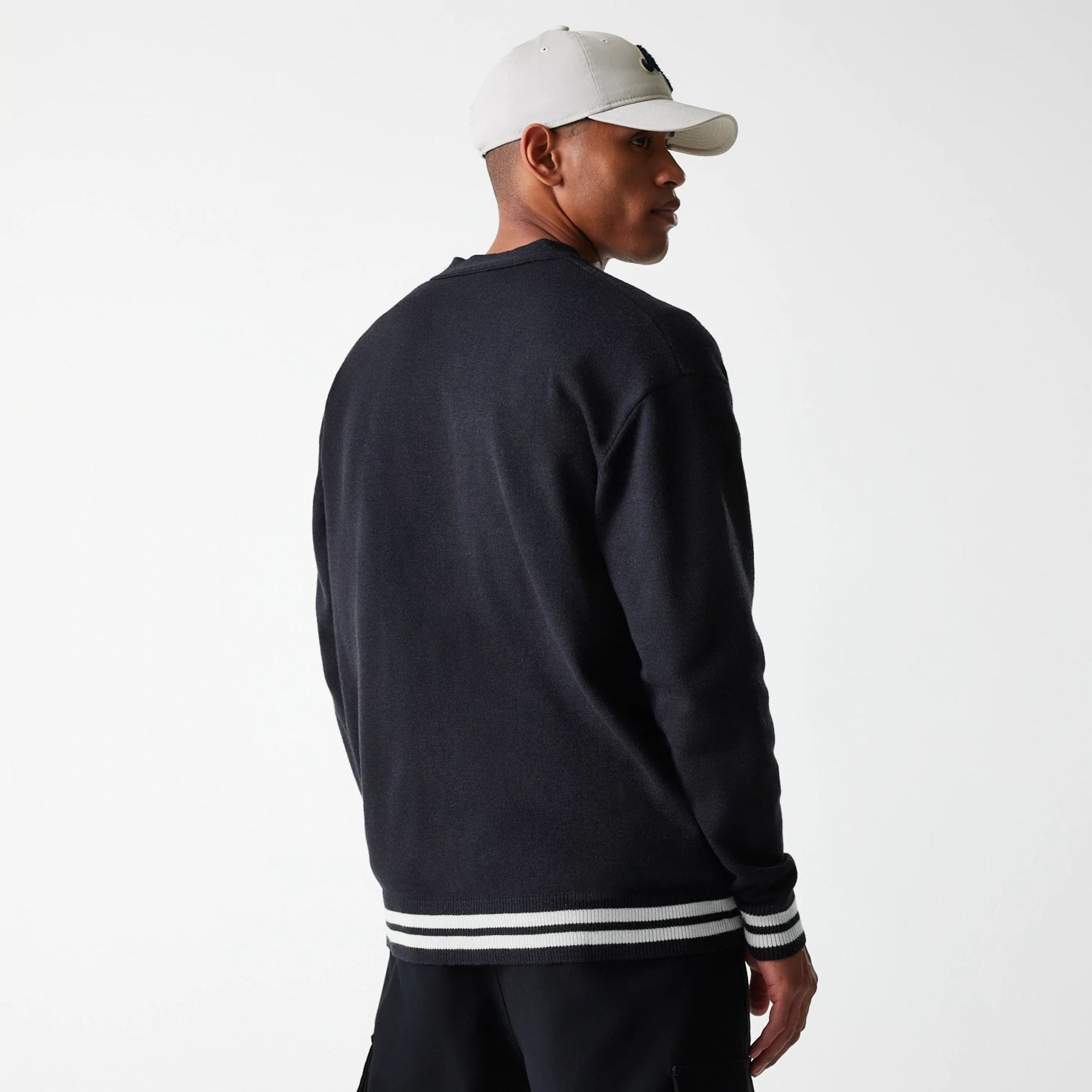 The Male model is wearing New Era Knit Black Cardigan 2