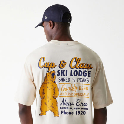 The Male model is wearing New Era Animal Graphic Light Beige Oversized T-Shirt 4