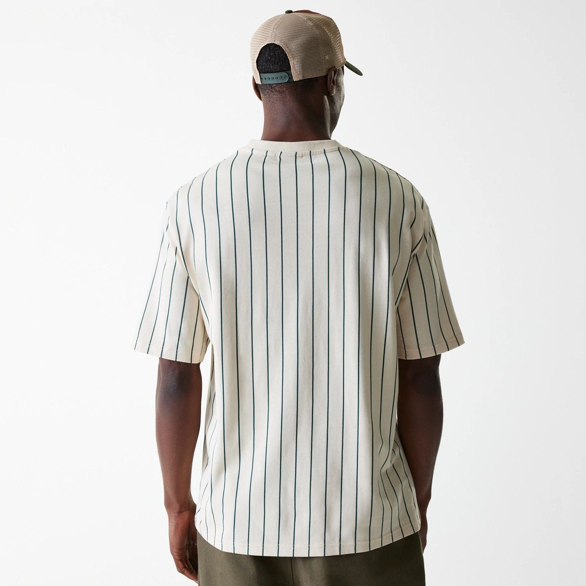 The Male model is wearing New Era Pinstripe Light Beige Oversized T-Shirt 2