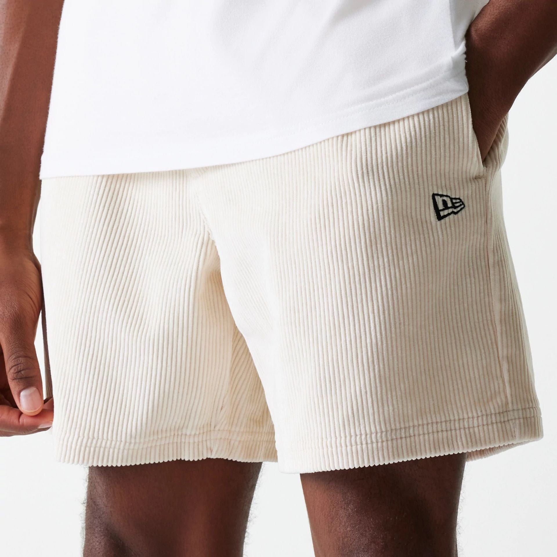 The Male model is wearing New Era Cord Light Beige Shorts 3