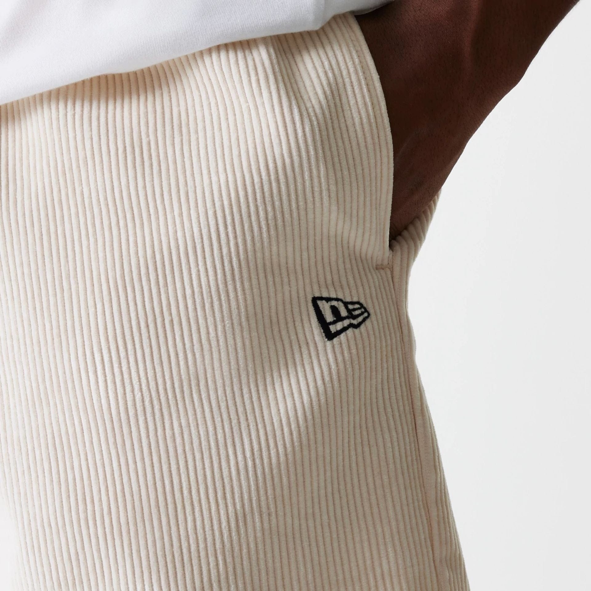 The Male model is wearing New Era Cord Light Beige Shorts 4