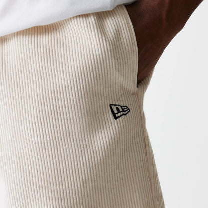 The Male model is wearing New Era Cord Light Beige Shorts 4