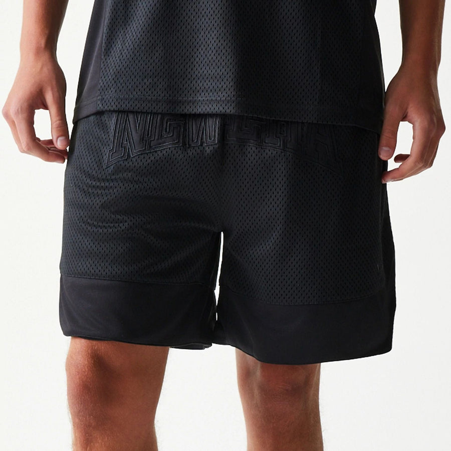 The Male model is wearing New Era Mesh Black Shorts 5
