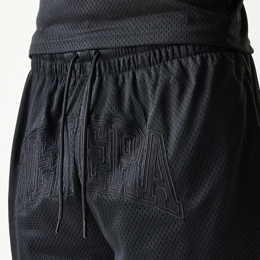 The Male model is wearing New Era Mesh Black Shorts 4