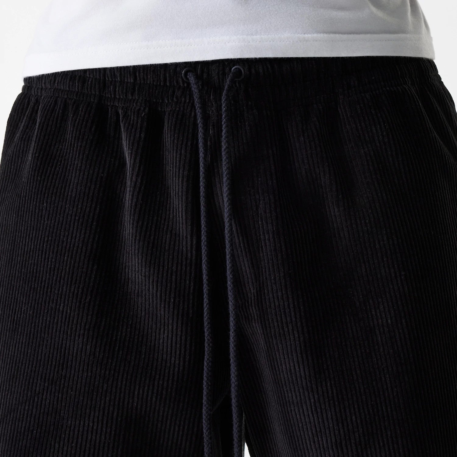 The Male model is wearing New Era Cord Black Shorts 3