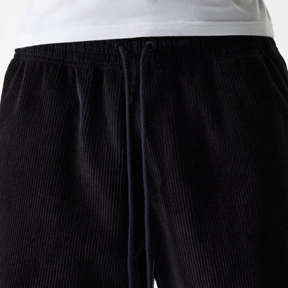 The Male model is wearing New Era Cord Black Shorts 3