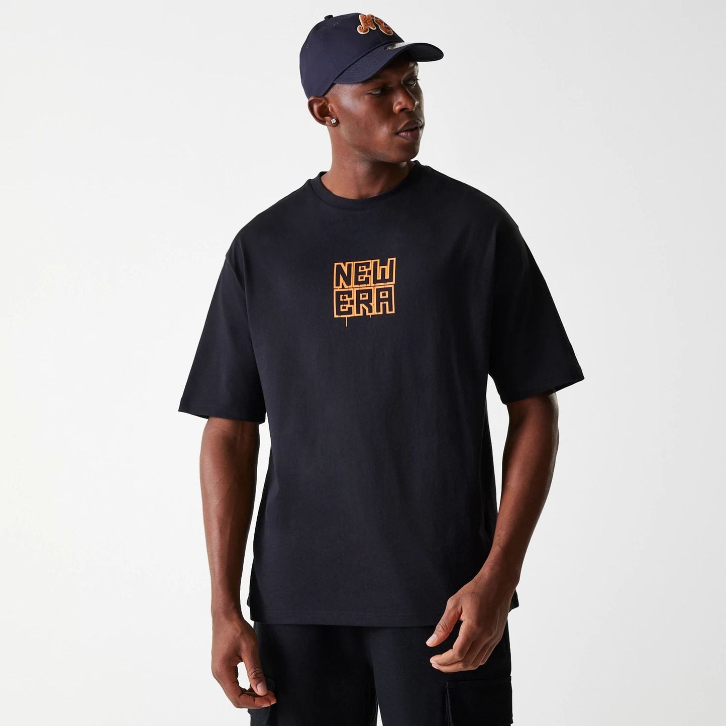 The Male model is wearing New Era Graffiti Graphic Black Oversized T-Shirt 3