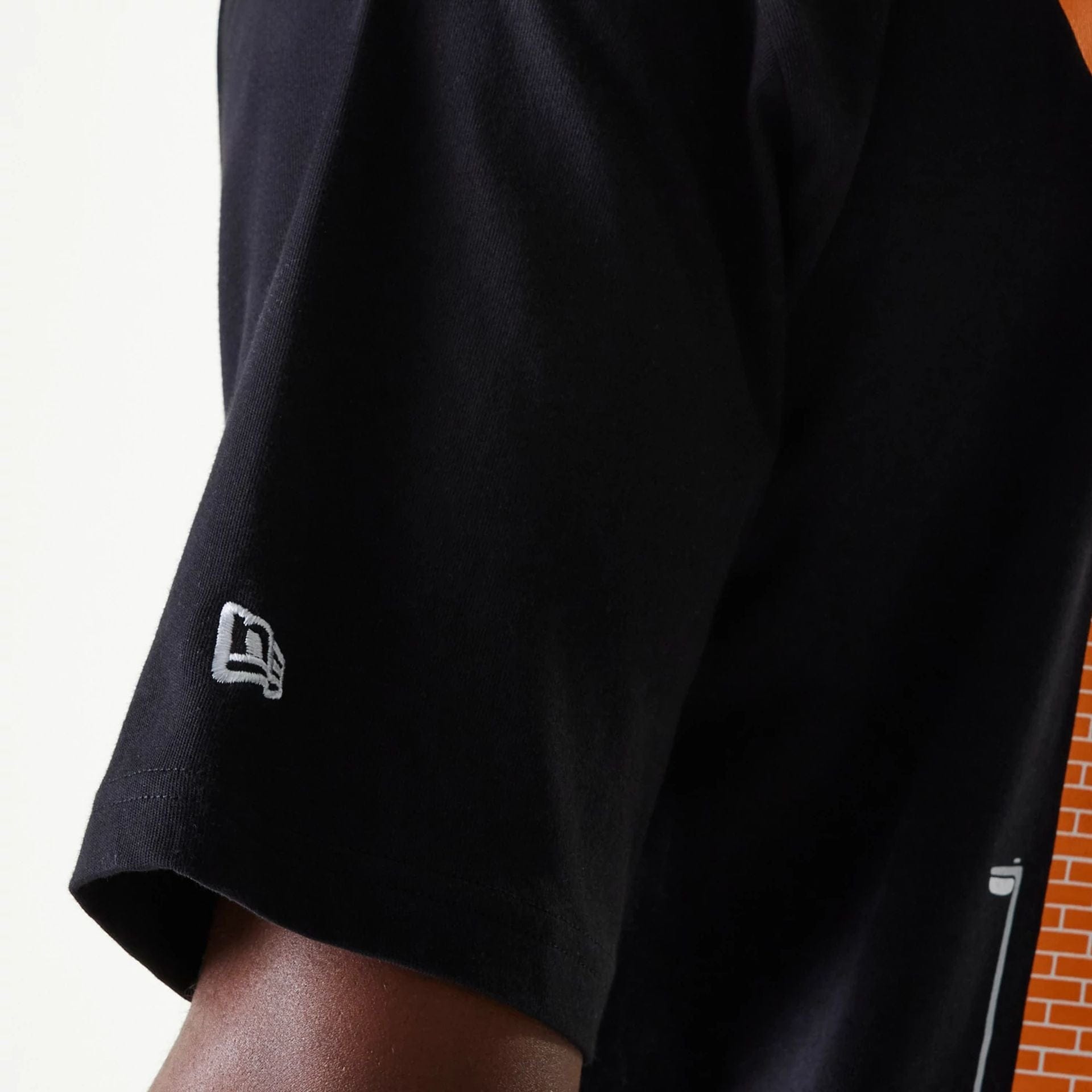 The Male model is wearing New Era Graffiti Graphic Black Oversized T-Shirt 8