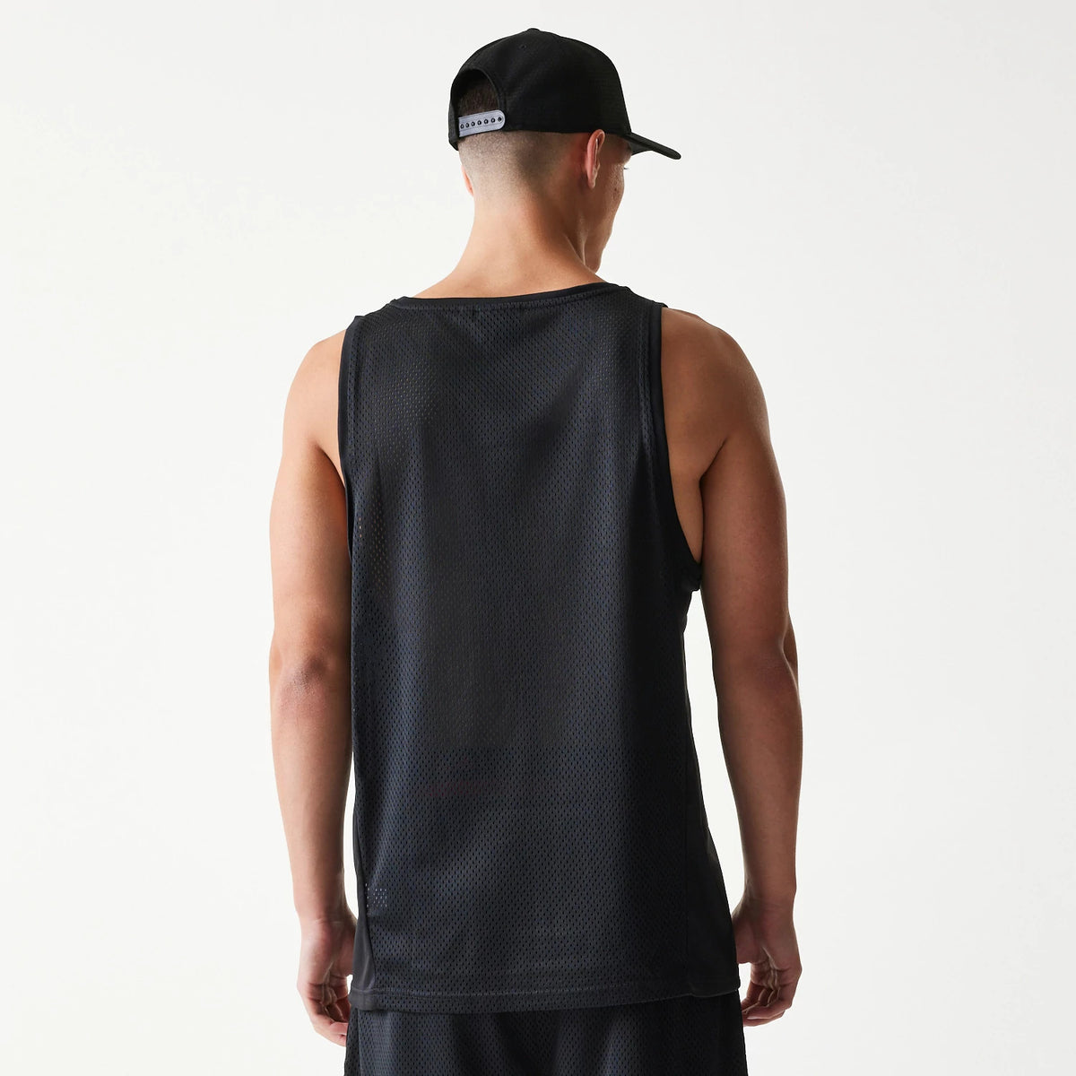 The Male model is wearing New Era Mesh Black Mesh Vest 2