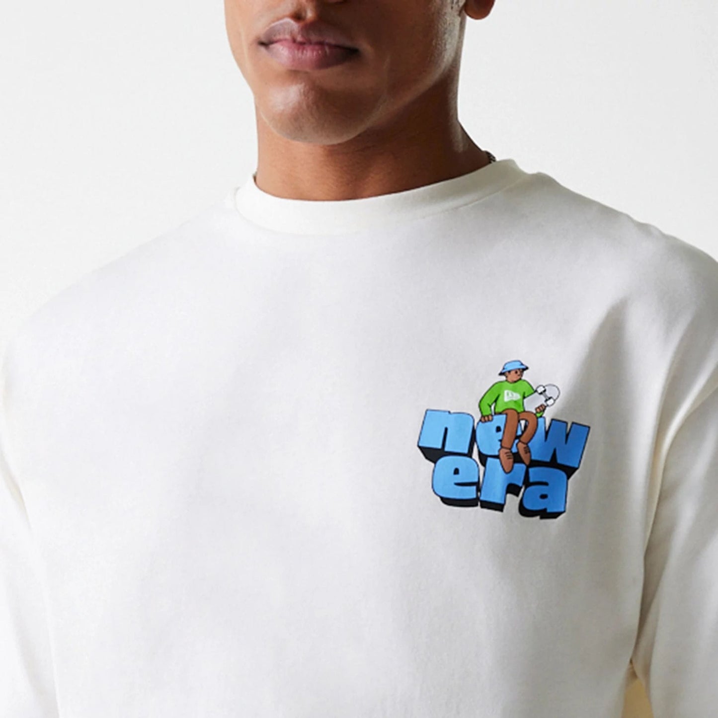The Male model is wearing New Era Skate Graphic Open White Oversized T-Shirt 5