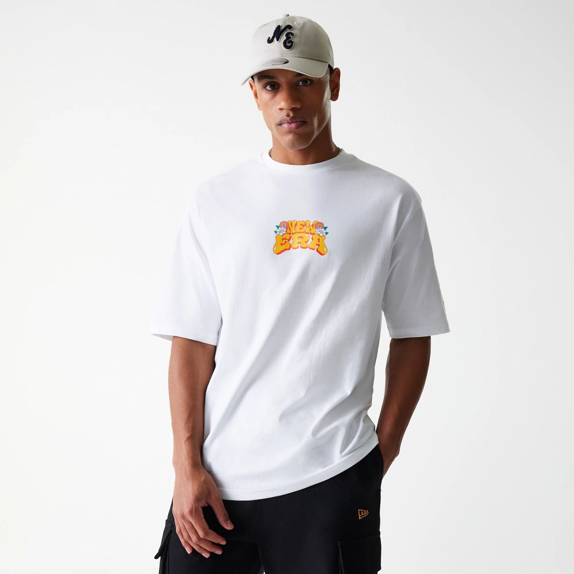 The Male model is wearing New Era Graphic White Oversized T-Shirt 3