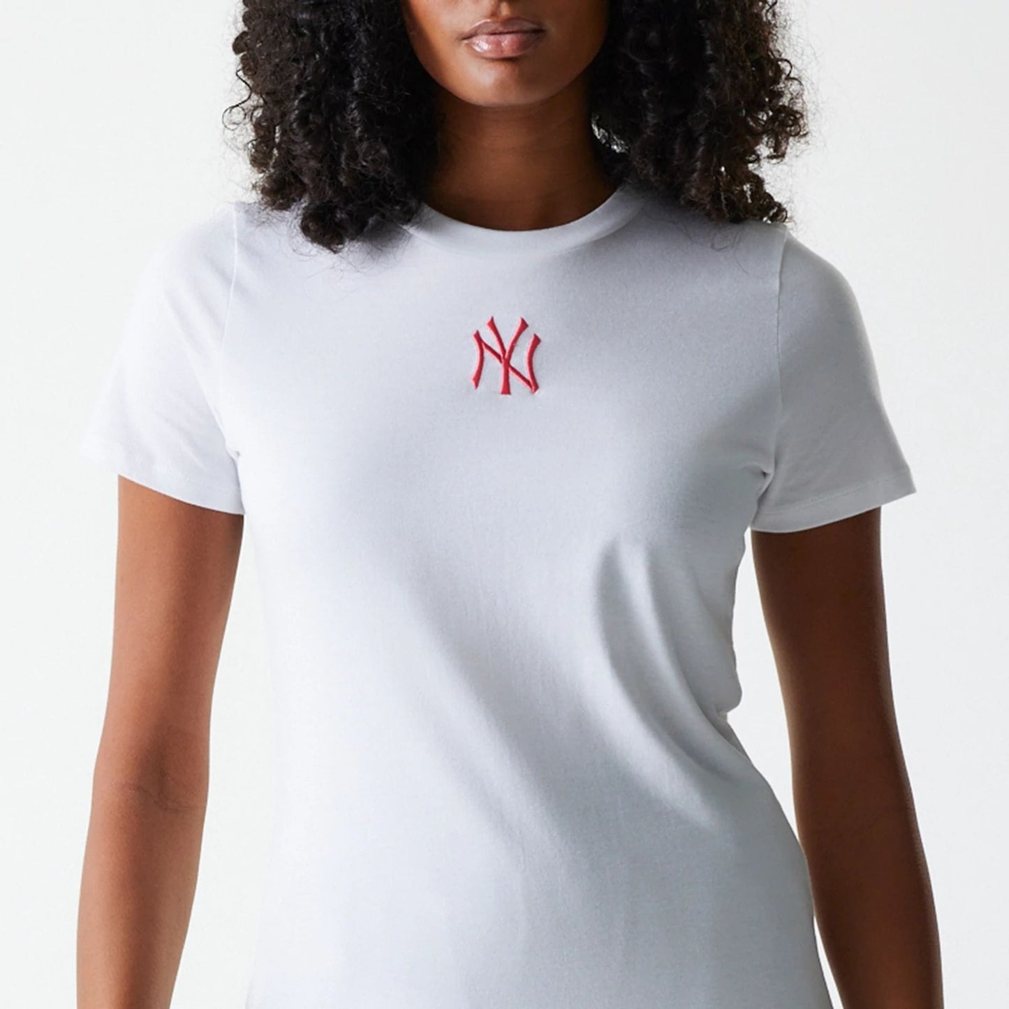 The Female model is wearing New York Yankees Womens MLB Midi League Essential White T-Shirt 3