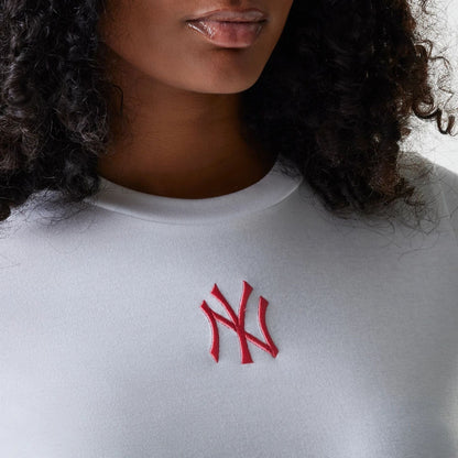 The Female model is wearing New York Yankees Womens MLB Midi League Essential White T-Shirt 4