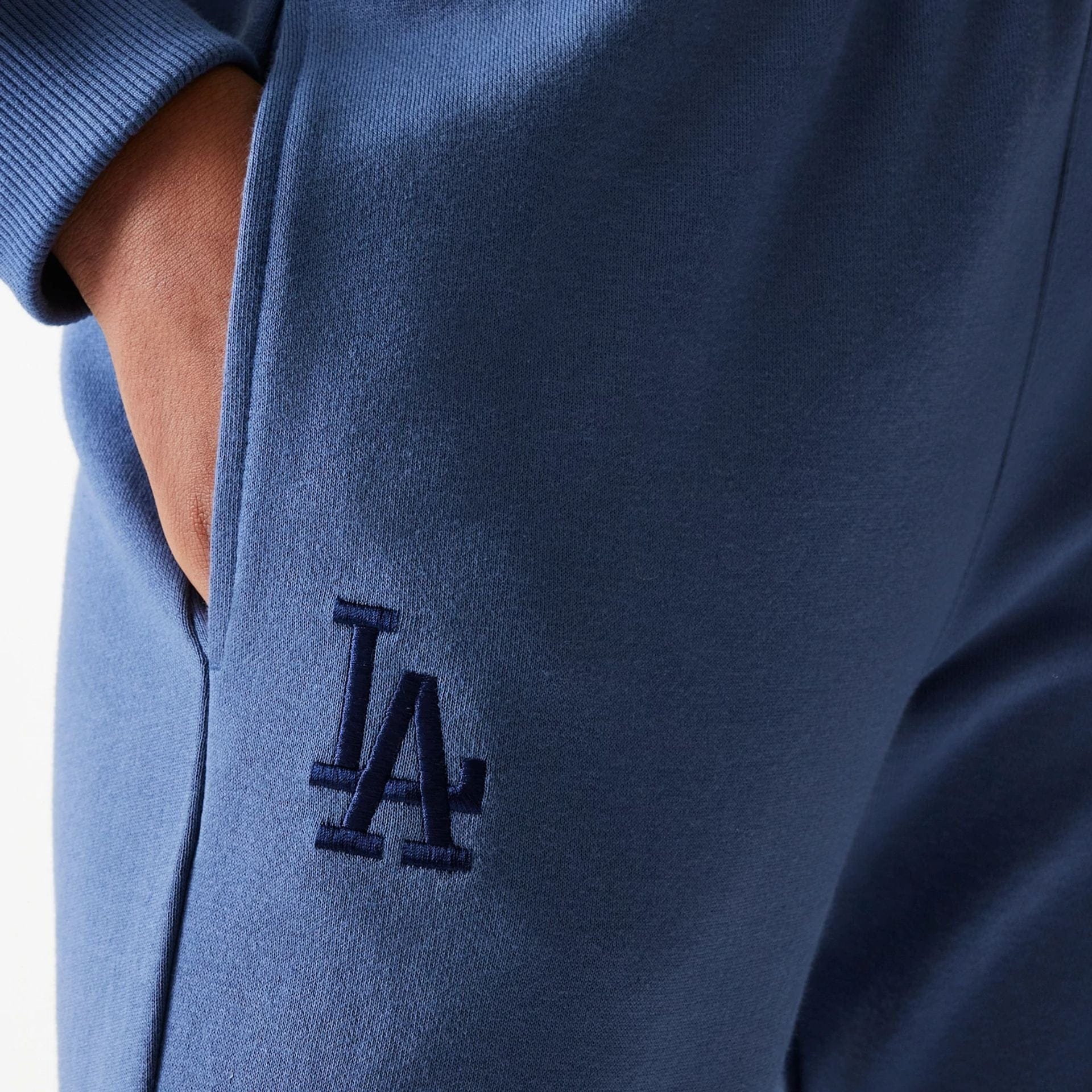 The Female model is wearing LA Dodgers Womens MLB Midi League Essential Dark Blue Joggers 3