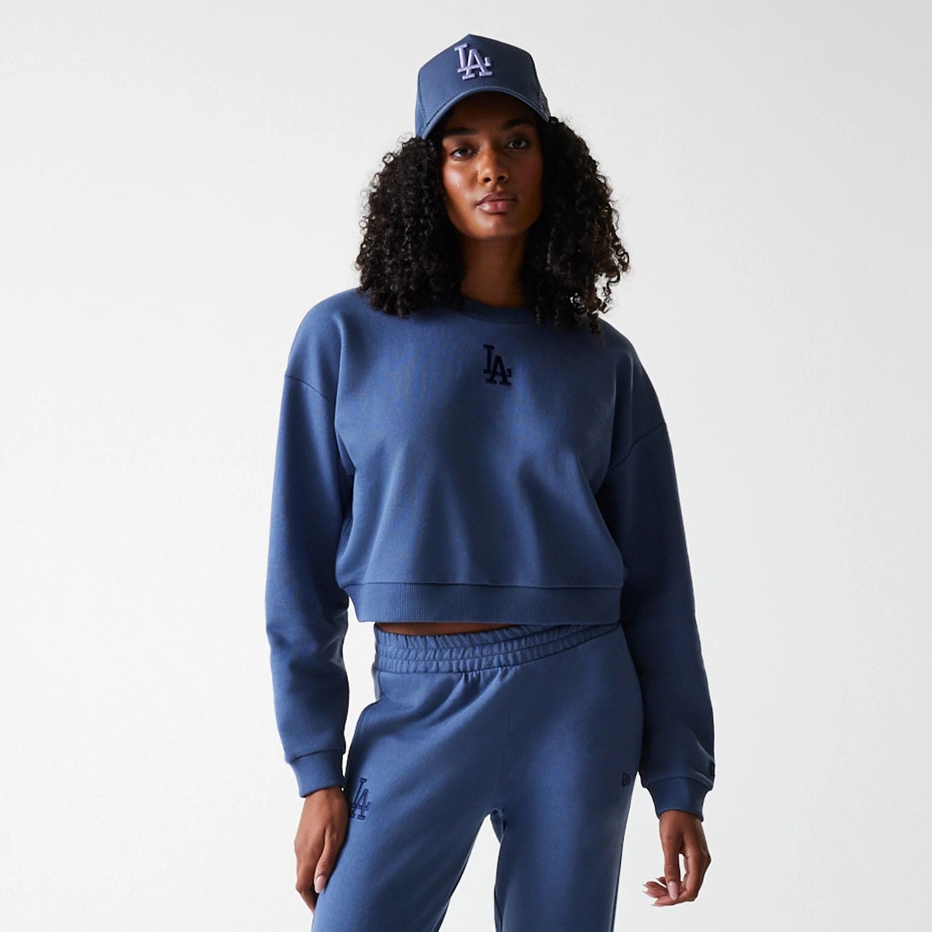 The Female model is wearing LA Dodgers Womens MLB Midi League Essential Dark Blue Cropped Crew Neck Sweater 3
