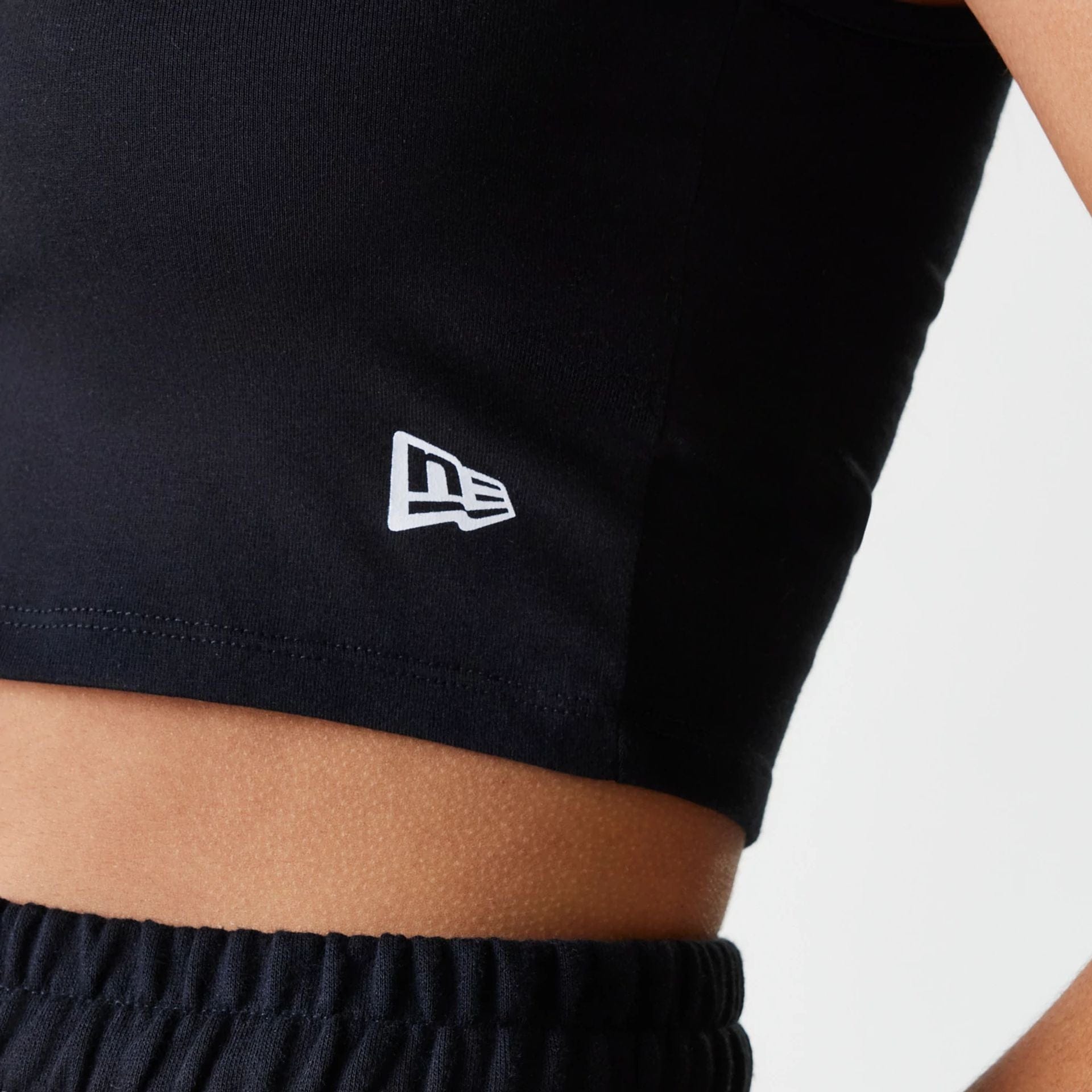 The Female model is wearing New York Yankees Womens MLB Midi League Essential Black Crop Tank Top 5