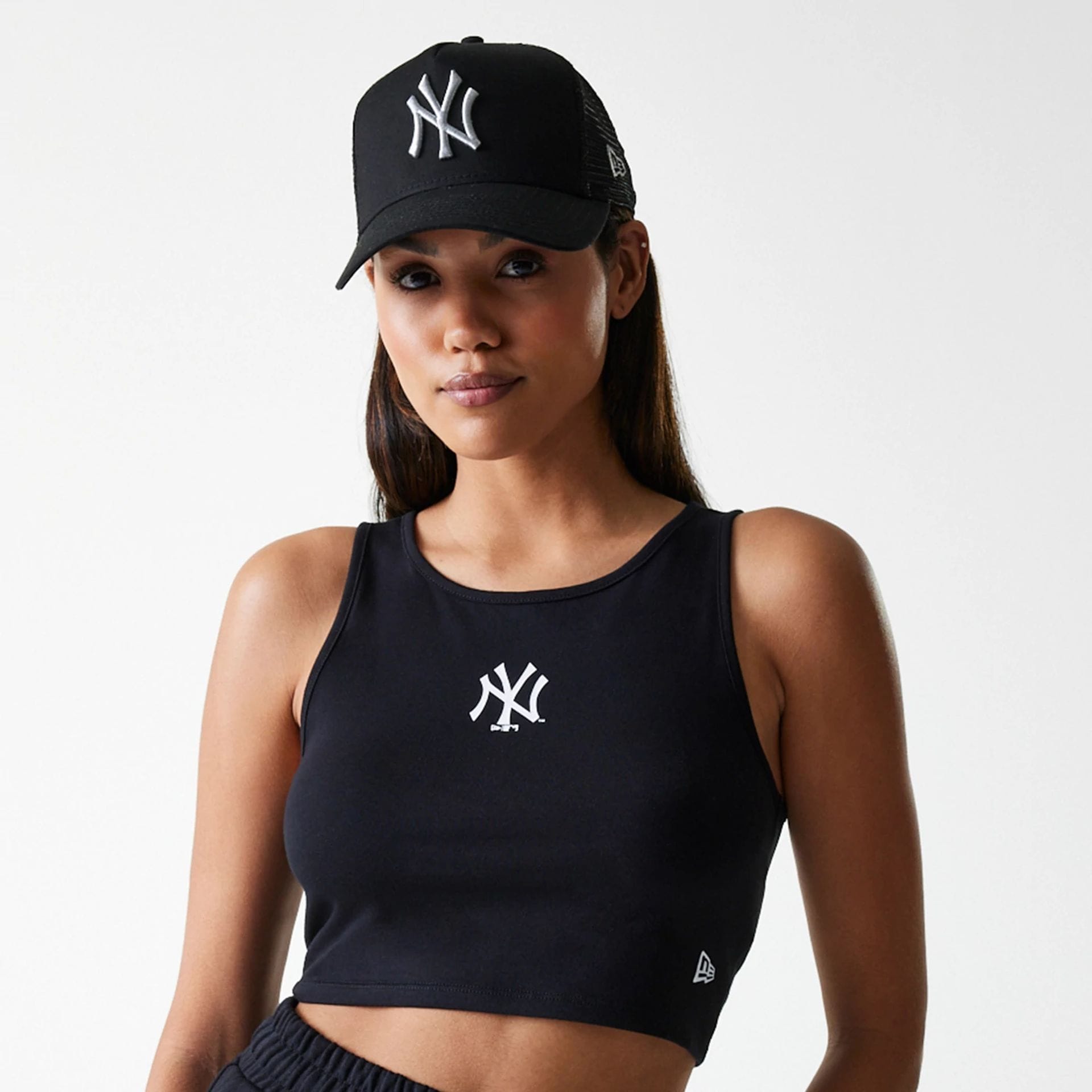 The Female model is wearing New York Yankees Womens MLB Midi League Essential Black Crop Tank Top 6