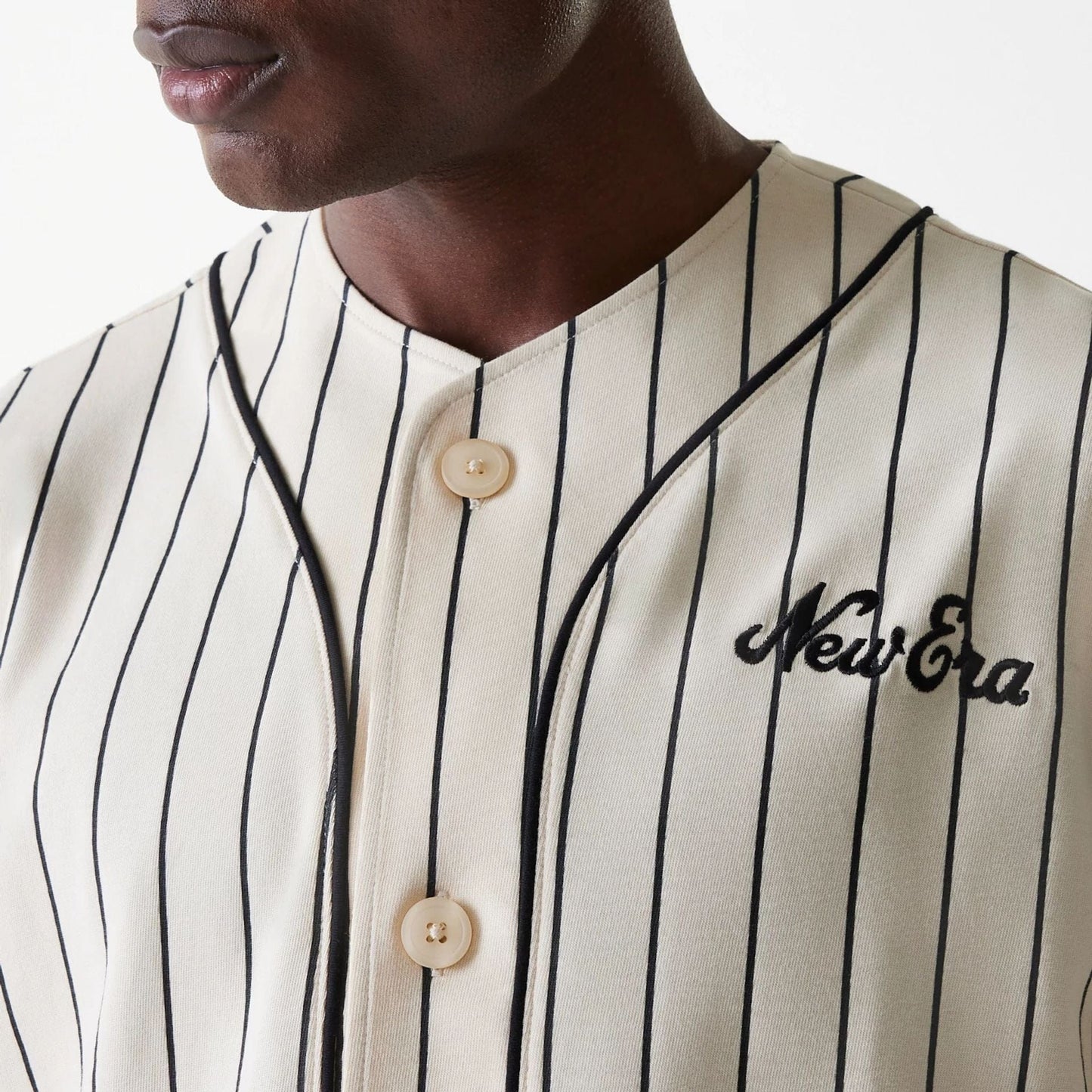 The Male model is wearing New Era Pinstripe Light Beige Jersey 4