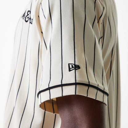 The Male model is wearing New Era Pinstripe Light Beige Jersey 5