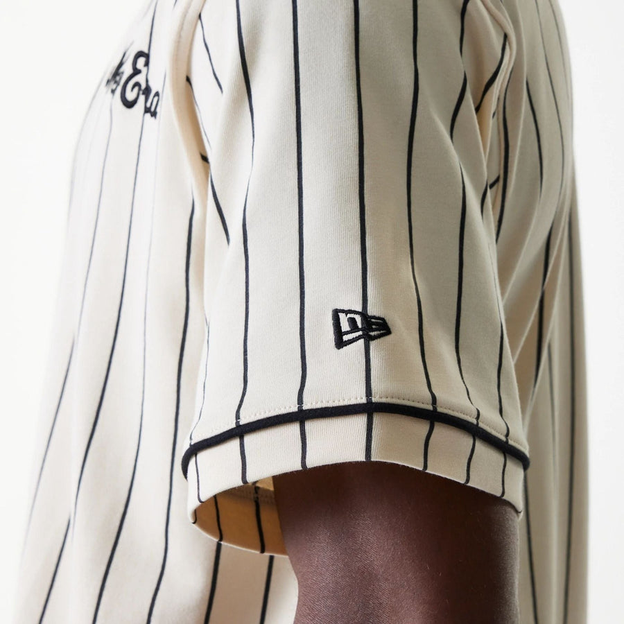 The Male model is wearing New Era Pinstripe Light Beige Jersey 5