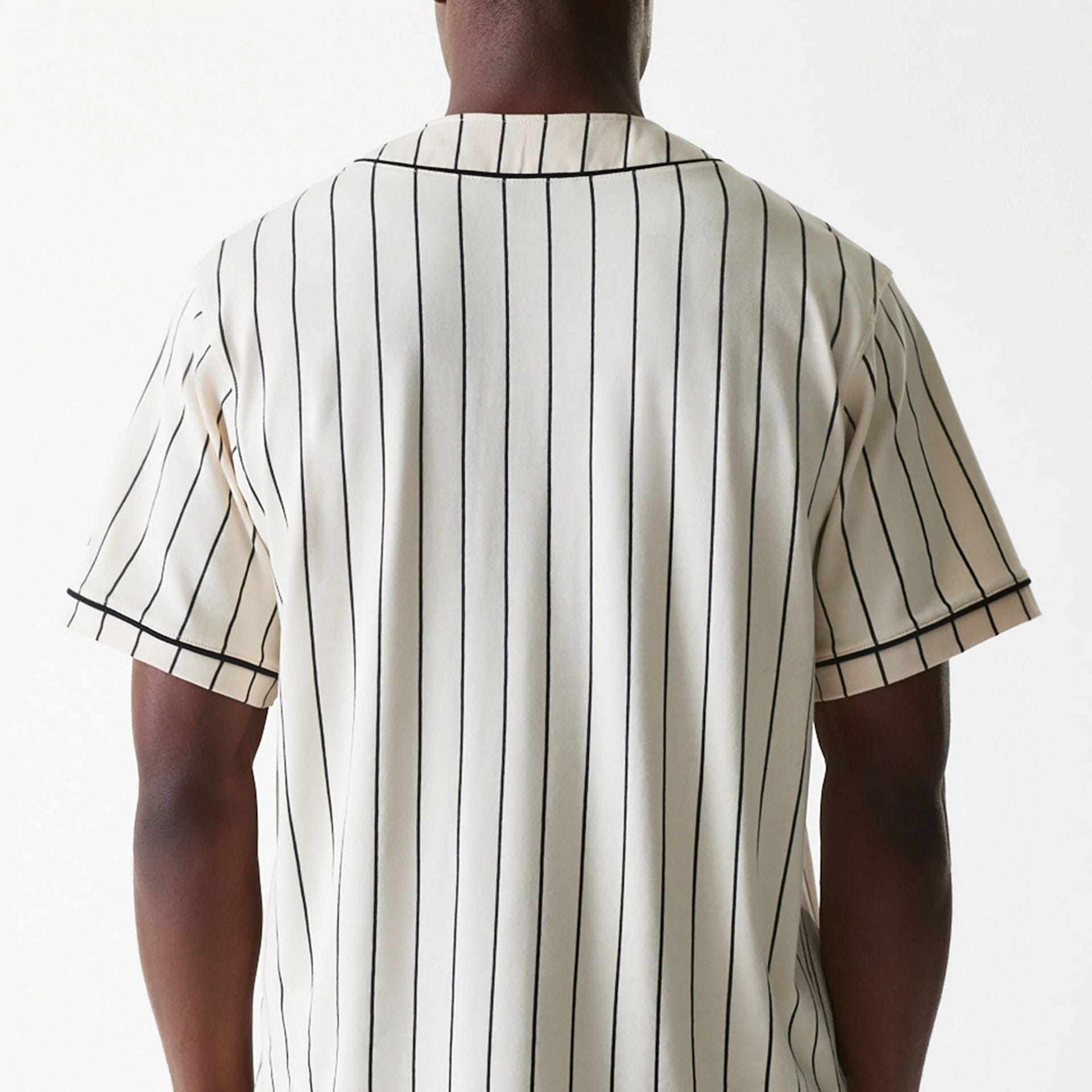 The Male model is wearing New Era Pinstripe Light Beige Jersey 7