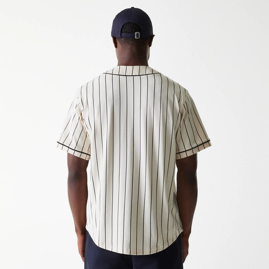 The Male model is wearing New Era Pinstripe Light Beige Jersey 2