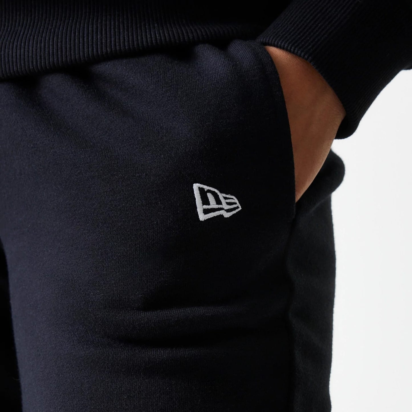 The Female model is wearing New York Yankees Womens MLB Midi League Essential Black Joggers 4