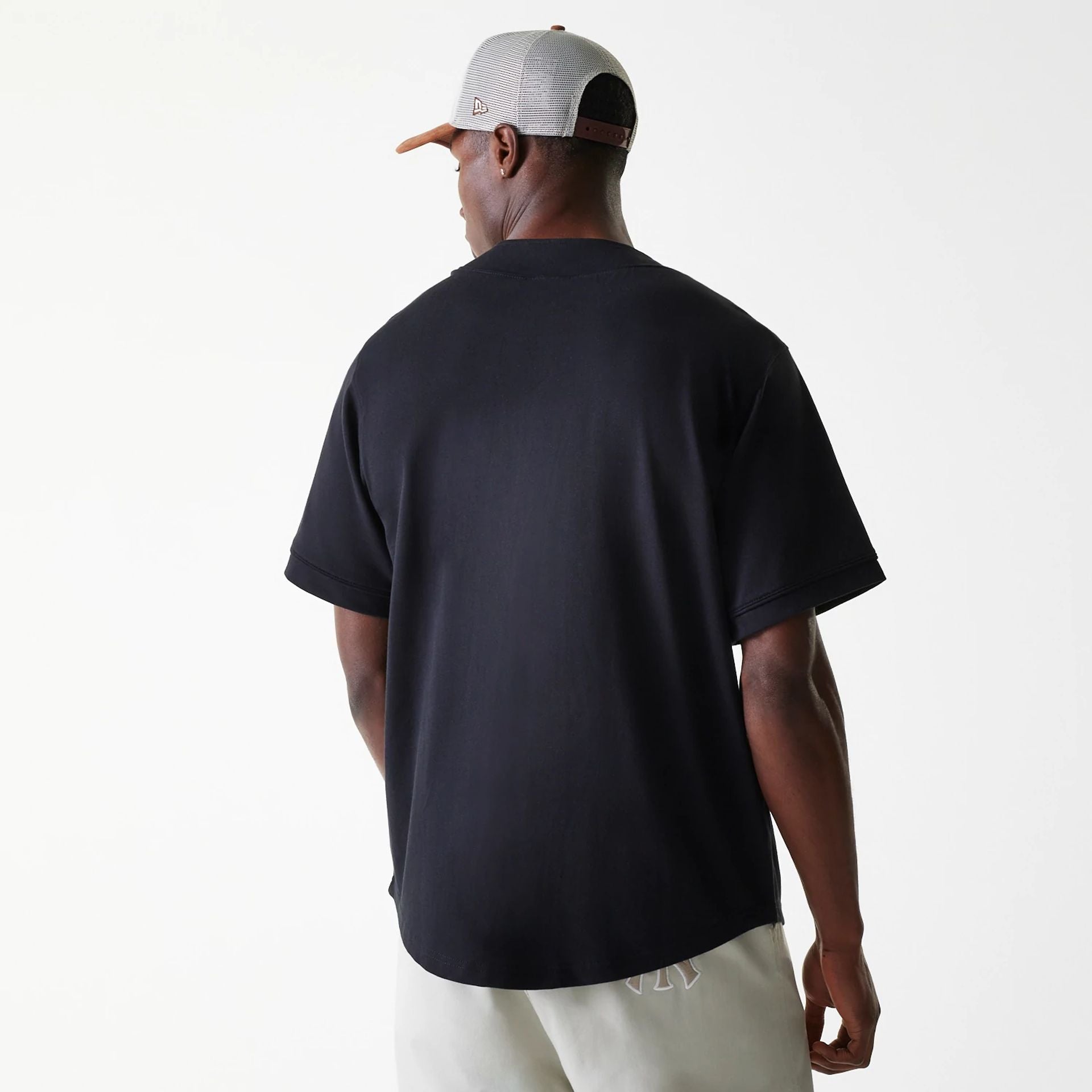 The Male model is wearing New Era Pinstripe Black Jersey 2