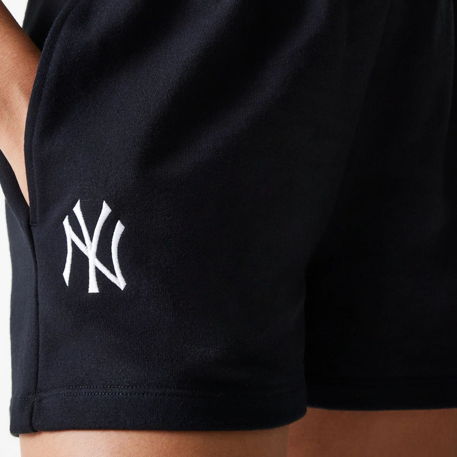 The Female model is wearing New York Yankees Womens MLB Midi League Essential Black Shorts 3