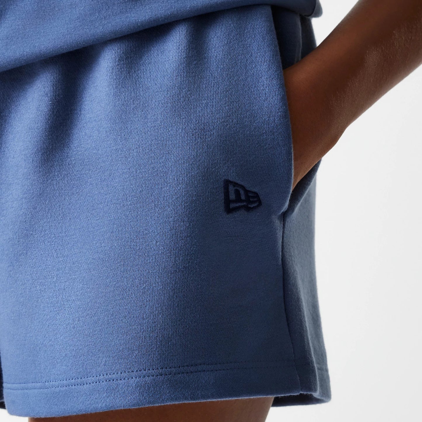 The Female model is wearing LA Dodgers Womens MLB Midi League Essential Dark Blue Shorts 4