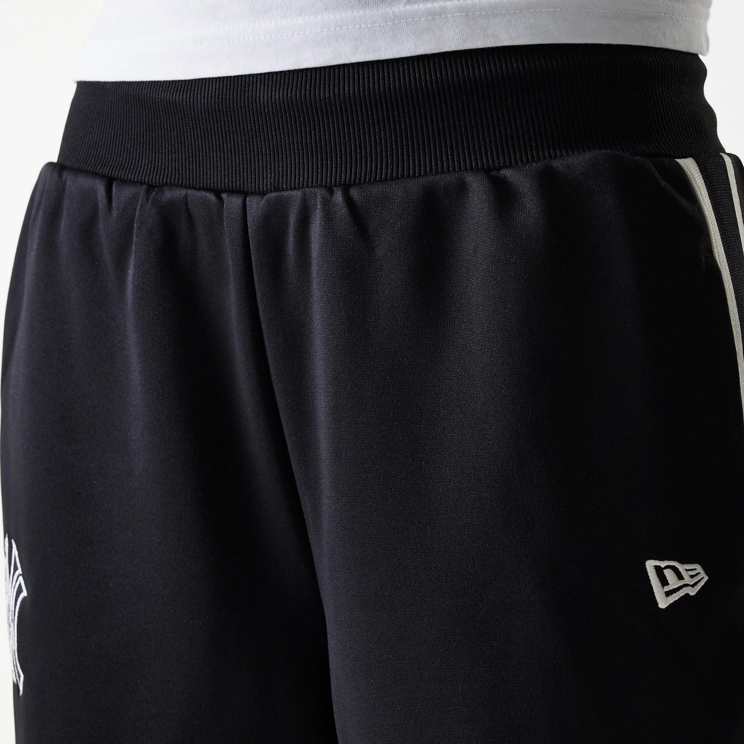 The Female model is wearing New York Yankees Womens MLB Midi Logo Black Track Pants 5