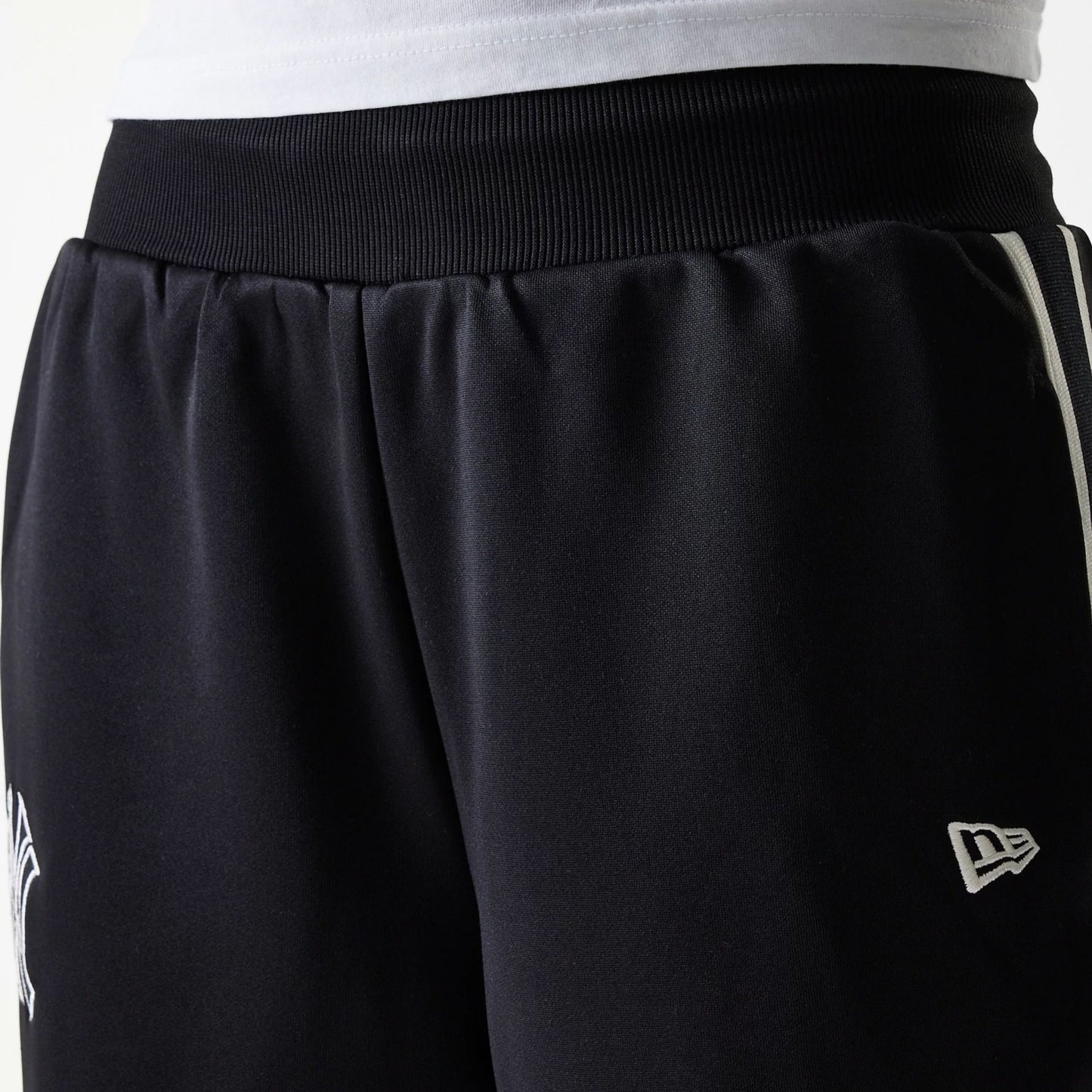 The Female model is wearing New York Yankees Womens MLB Midi Logo Black Track Pants 5