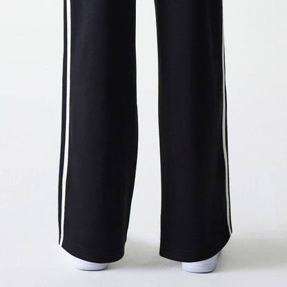 The Female model is wearing New York Yankees Womens MLB Midi Logo Black Track Pants 7