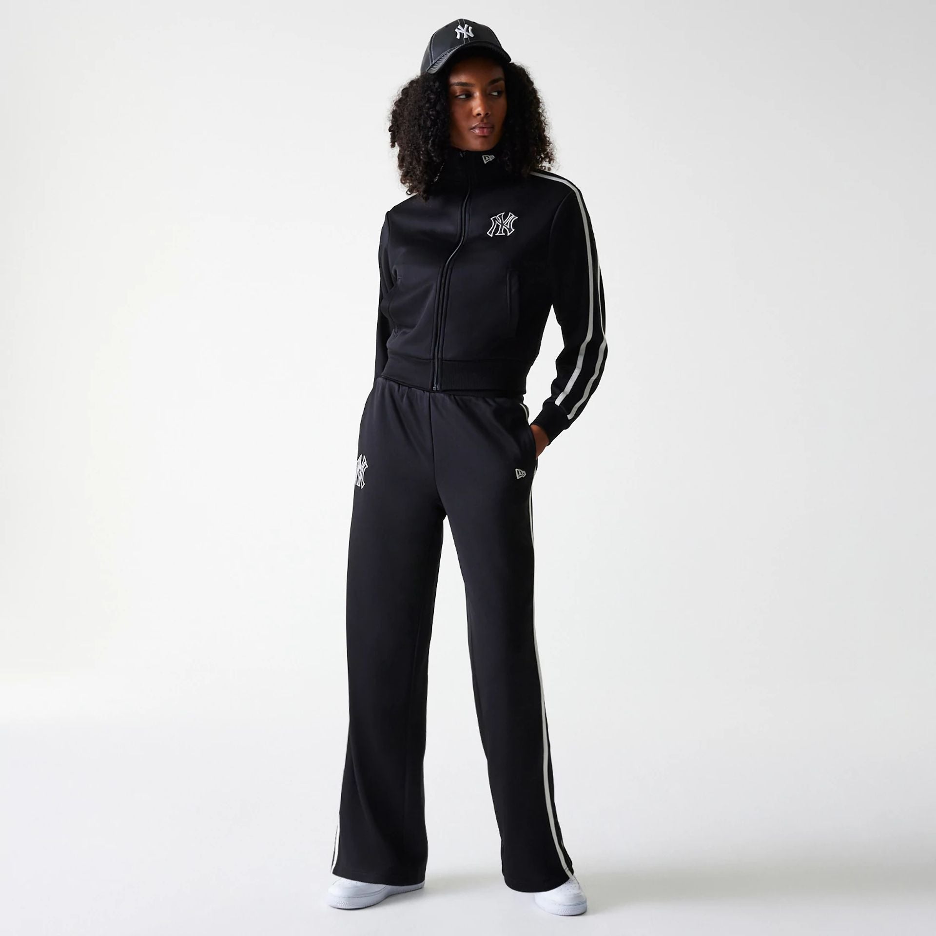 The Female model is wearing New York Yankees Womens MLB Midi Logo Black Track Pants 8