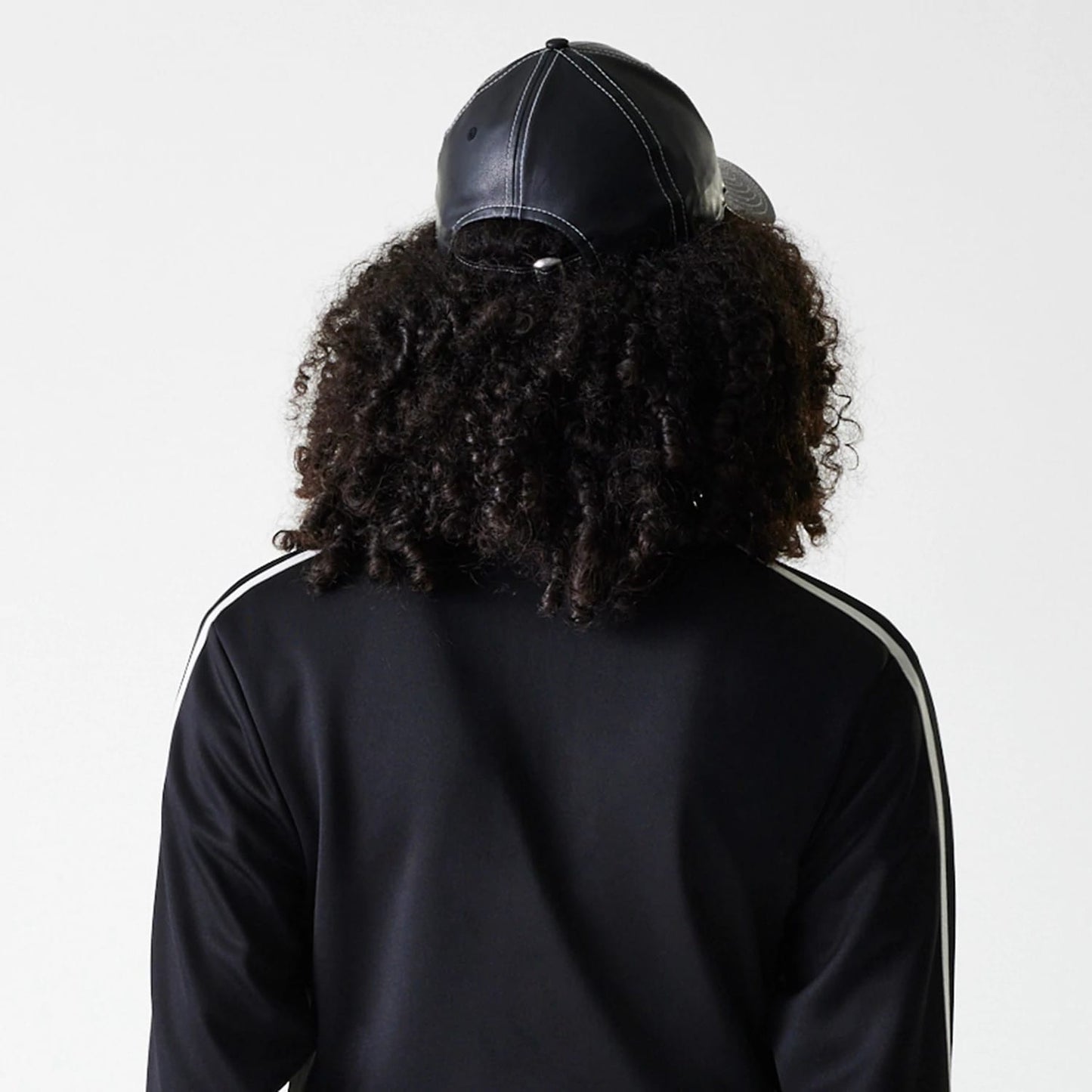 The Female model is wearing New York Yankees Womens MLB Midi Logo Black Track Jacket 6