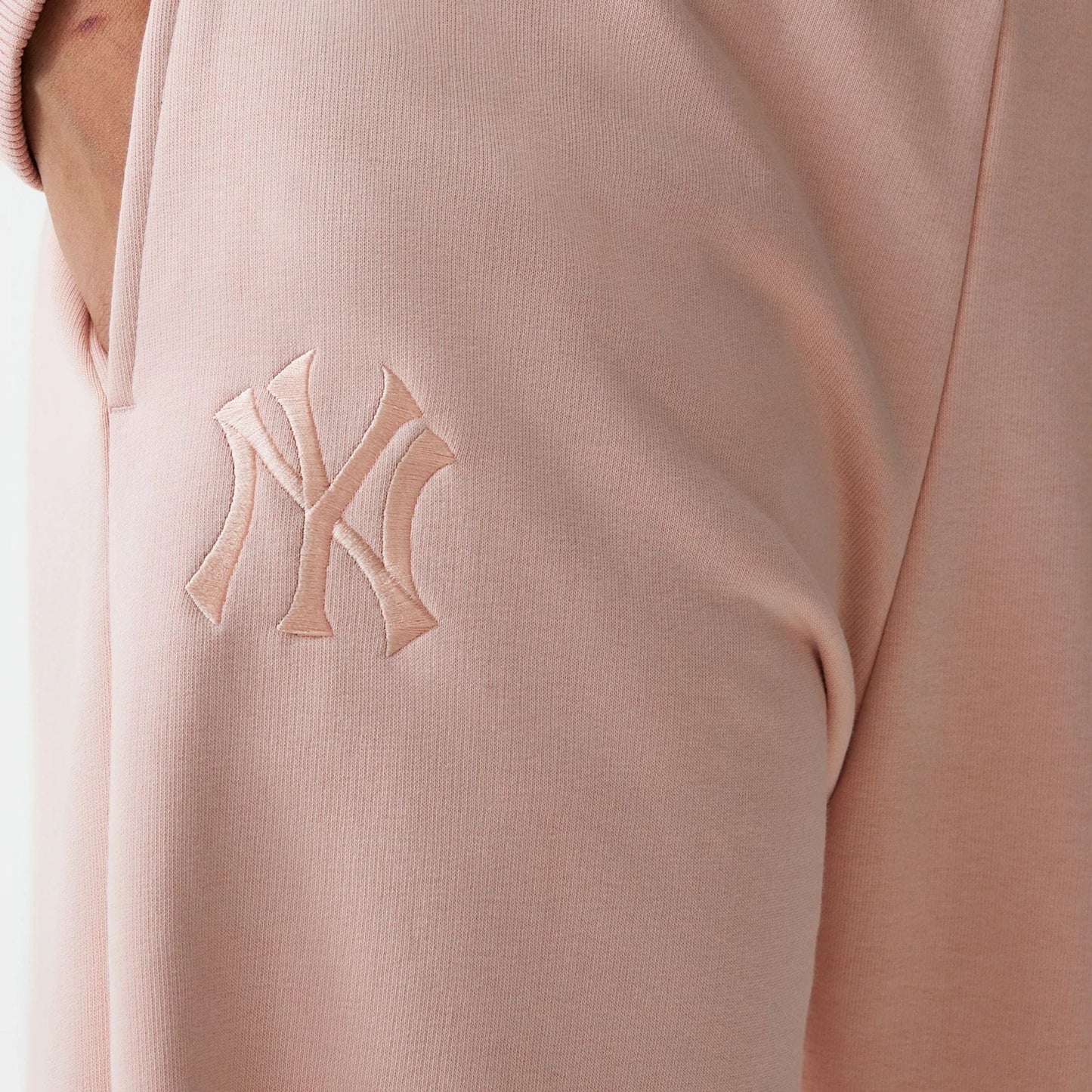 The Female model is wearing New York Yankees Womens MLB Tonal Pastel Pink Straight Leg Joggers 6