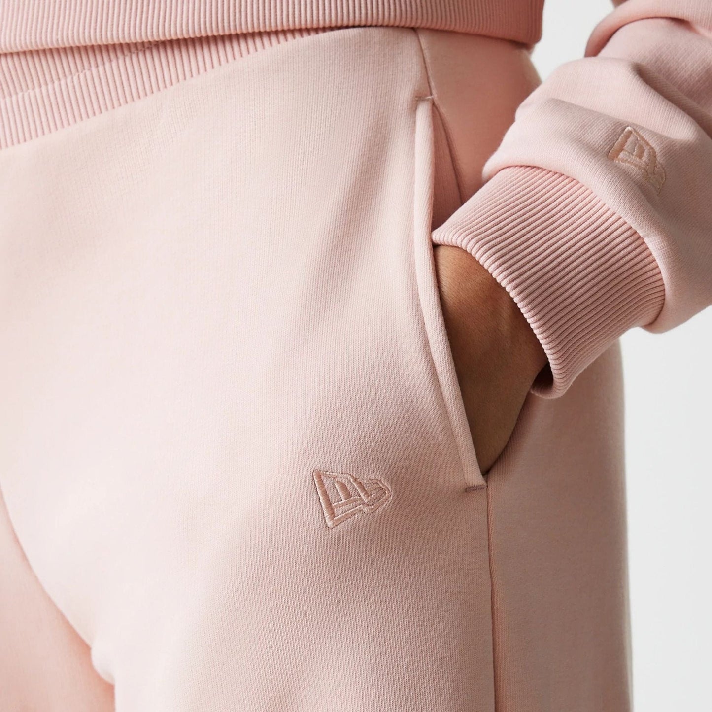 The Female model is wearing New York Yankees Womens MLB Tonal Pastel Pink Straight Leg Joggers 3