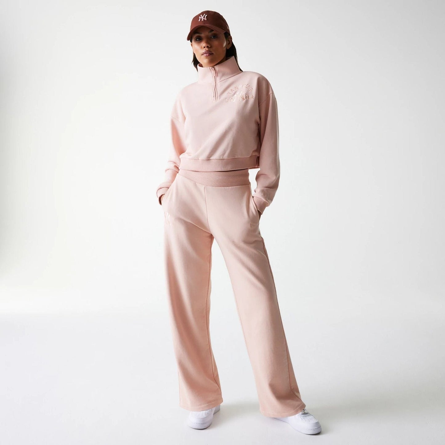 The Female model is wearing New York Yankees Womens MLB Tonal Pastel Pink Straight Leg Joggers 8