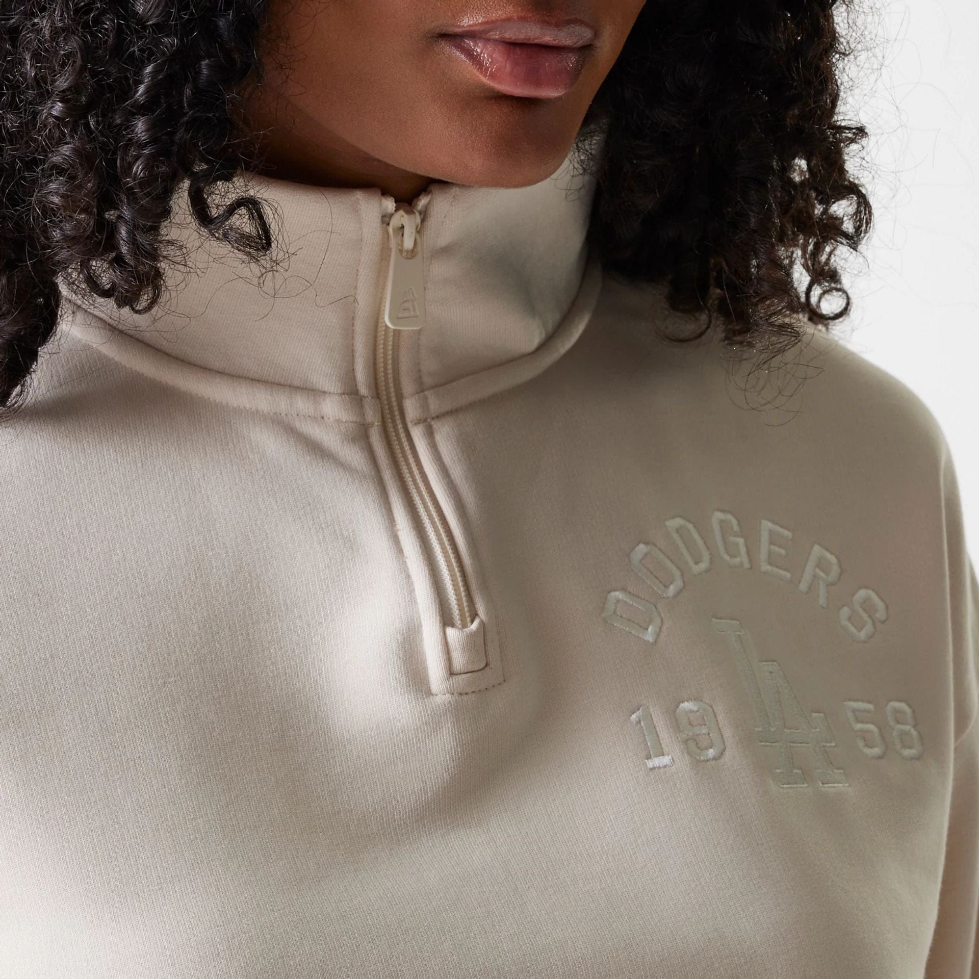The Female model is wearing LA Dodgers Womens MLB Tonal Light Beige Cropped 1/4 Zip Sweater 4