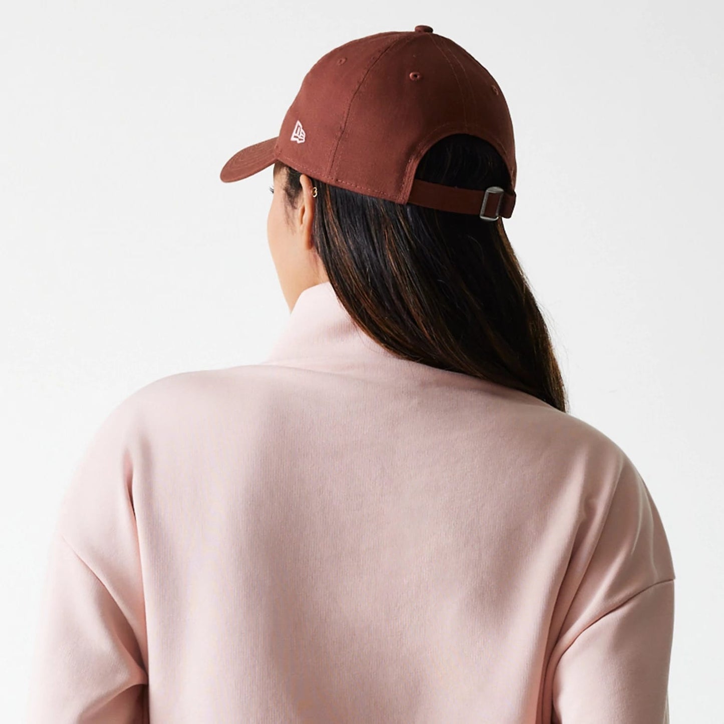 The Female model is wearing New York Yankees Womens MLB Tonal Pastel Pink Cropped 1/4 Zip Sweater 7
