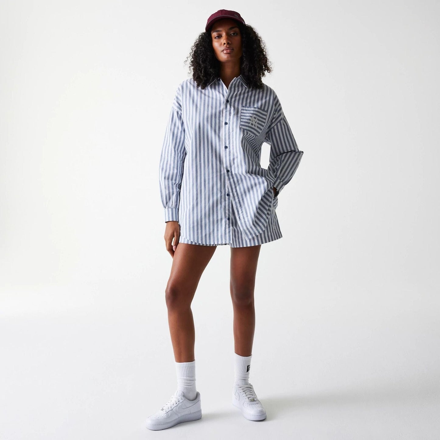 The Female model is wearing New York Yankees Womens MLB Stripe Dark Blue Long Sleeve Shirt 8