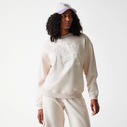 The Female model is wearing LA Dodgers Womens MLB Tonal Graphic Light Beige Oversized Crew Neck Sweater 1