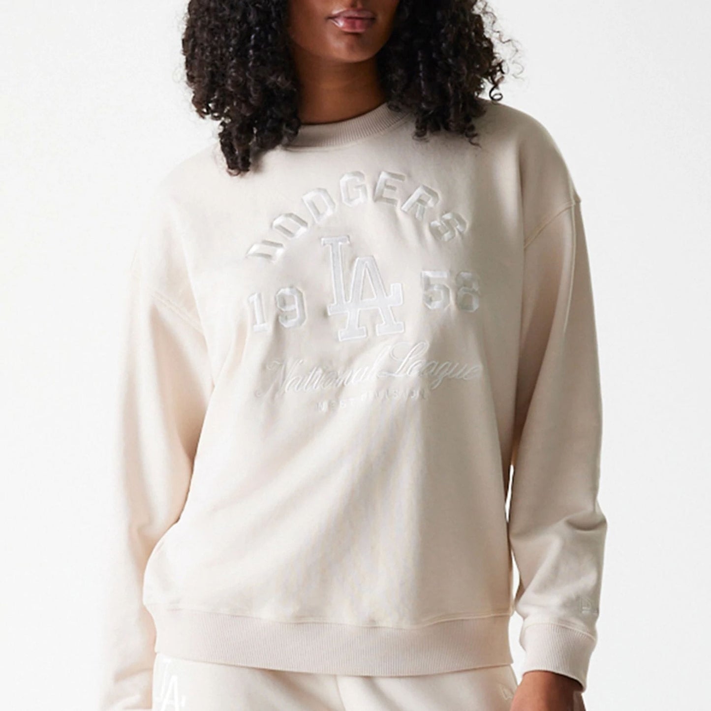 The Female model is wearing LA Dodgers Womens MLB Tonal Graphic Light Beige Oversized Crew Neck Sweater 3