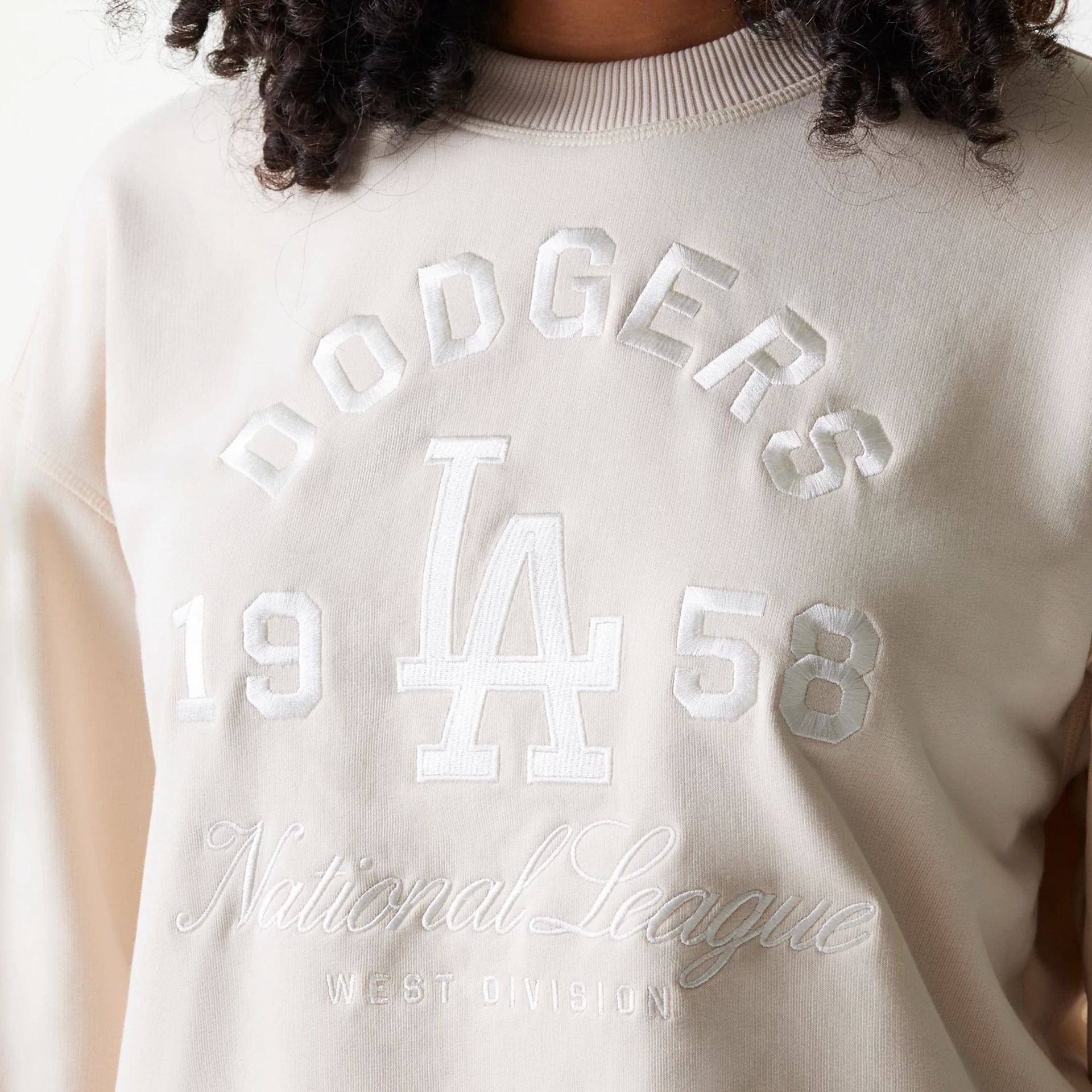 The Female model is wearing LA Dodgers Womens MLB Tonal Graphic Light Beige Oversized Crew Neck Sweater 4
