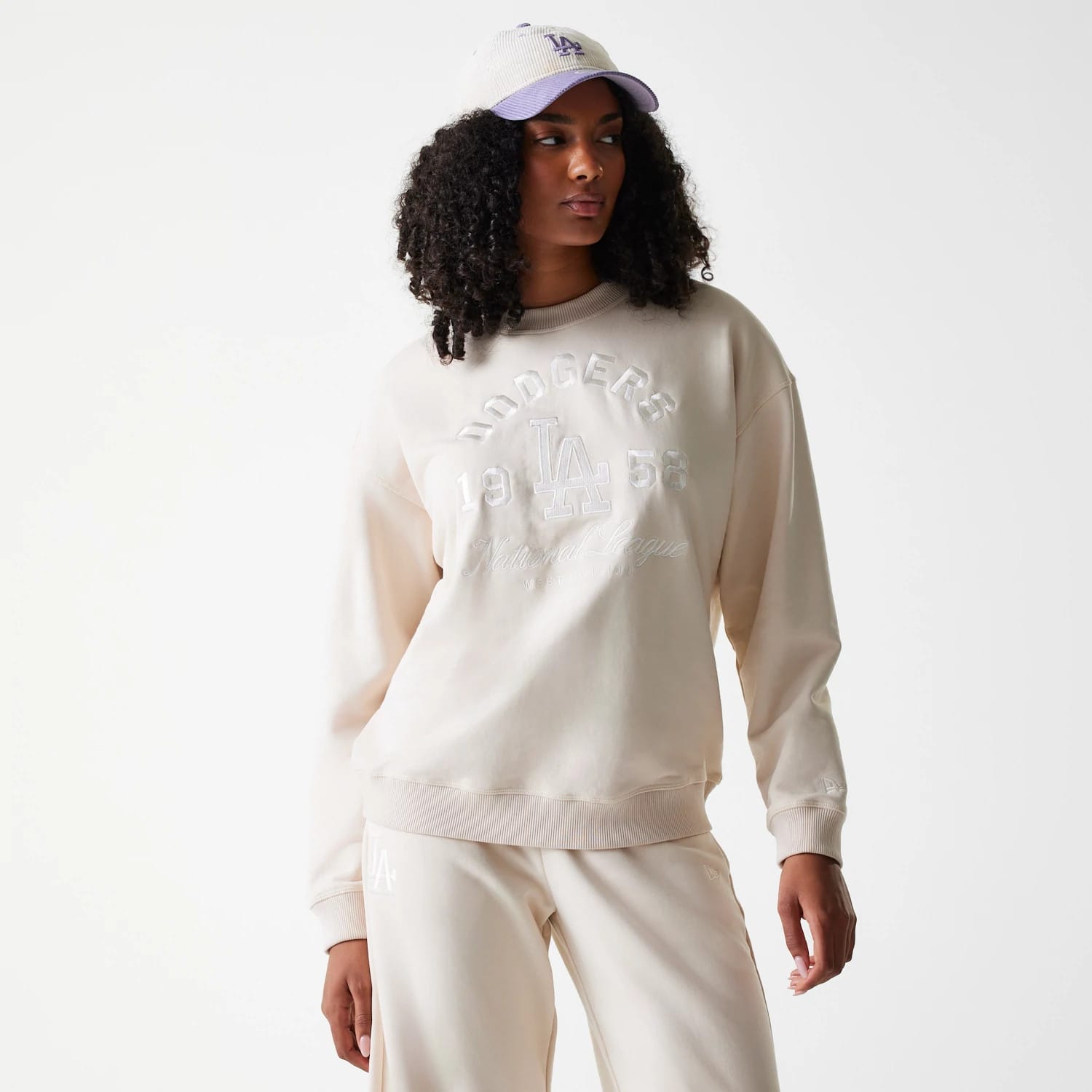 The Female model is wearing LA Dodgers Womens MLB Tonal Graphic Light Beige Oversized Crew Neck Sweater 1