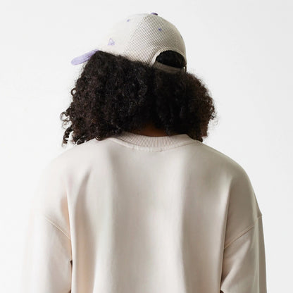 The Female model is wearing LA Dodgers Womens MLB Tonal Graphic Light Beige Oversized Crew Neck Sweater 7