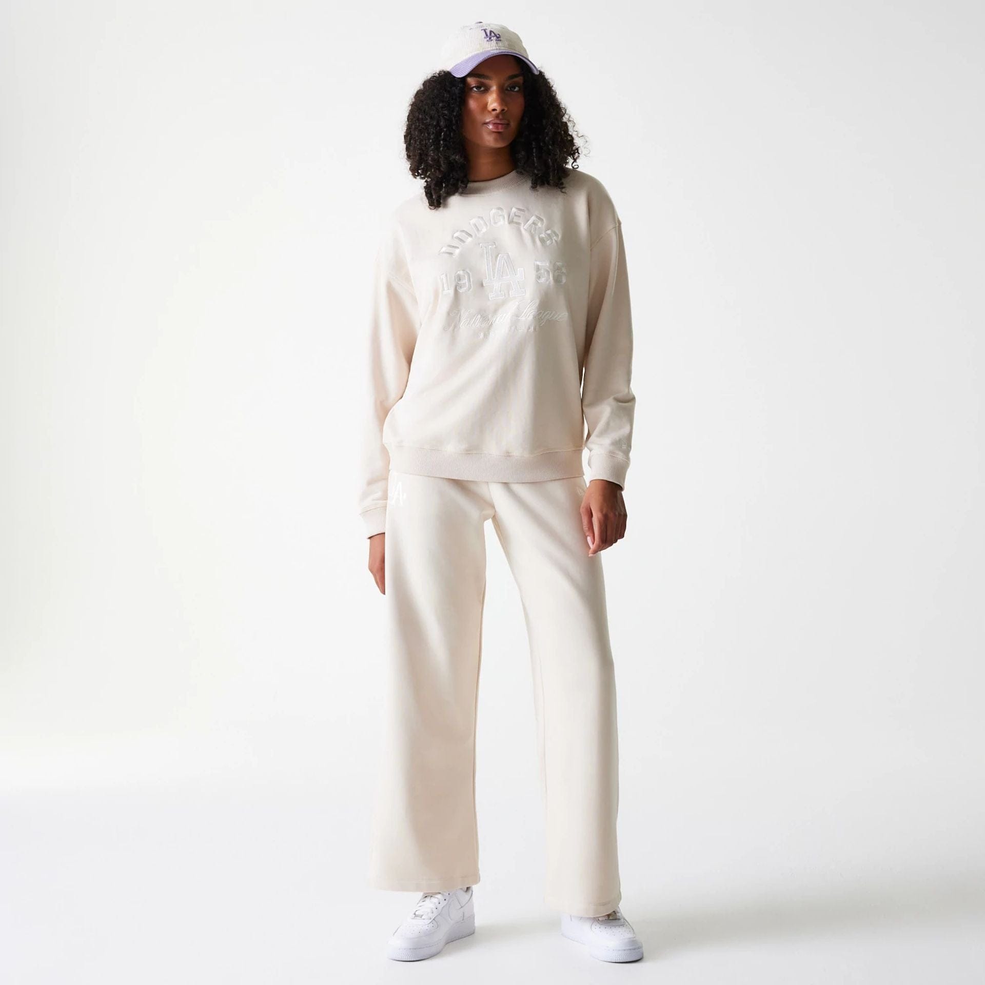 The Female model is wearing LA Dodgers Womens MLB Tonal Graphic Light Beige Oversized Crew Neck Sweater 8