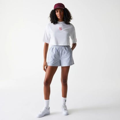 The Female model is wearing New York Yankees Womens MLB Stripe Dark Blue Shorts 7